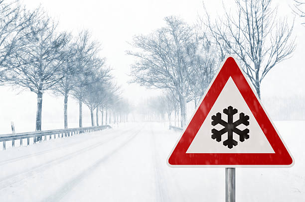 istock winter driving - snowy country road 460157927