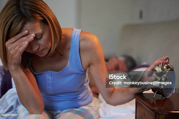 Woman Awake In Bed Suffering With Insomnia Stock Photo - Download Image Now - Mature Women, Night, Waking up