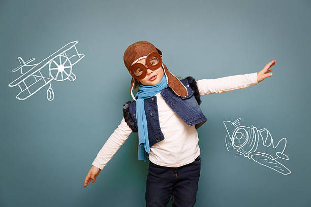 istock Child dressed up as pilot with goggles and hat 460203731