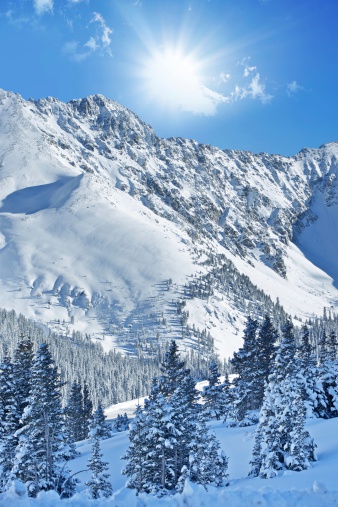 High mountain landscape with sun in the French Alps (La Grave, La Meije)