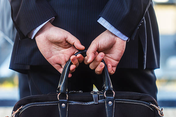 istock Back of an Asian businessman with briefcase 460210727