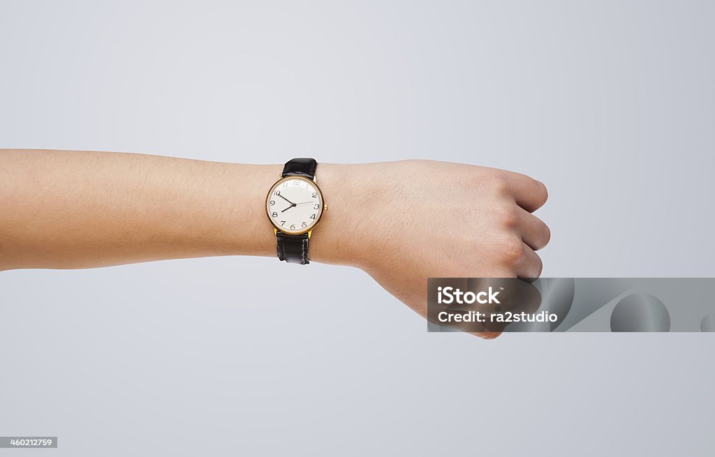 Hand with watch showing precise time Hand with modern watch showing precise time Wrist Stock Photo