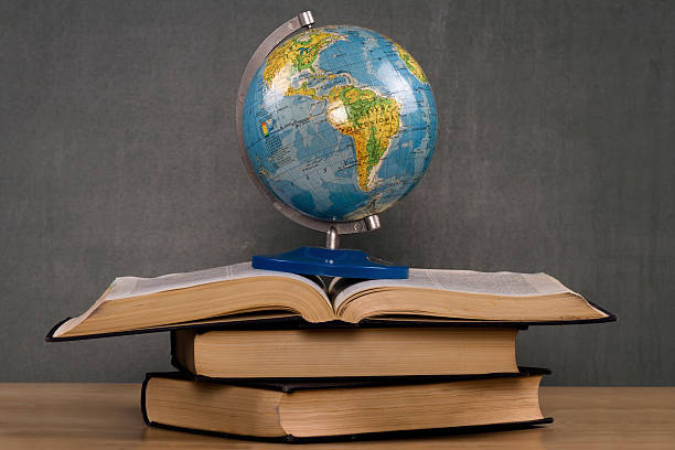 istock Globe standing on the books 460212777
