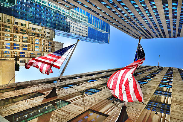 istock NY buildings, American flags 460213251