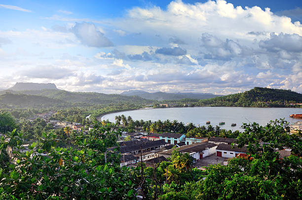 Baracoa Bay, Cuba Baracoa was discovered by Christopher Columbus during his first voyage, on 27th November 1492. El Yunque famous mountain in background baracoa stock pictures, royalty-free photos & images