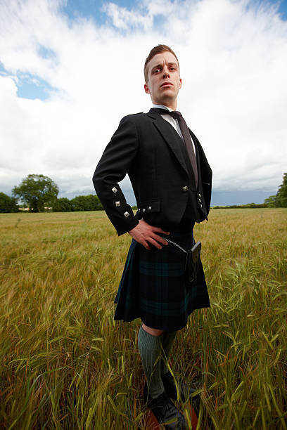 istock Proud scotsman in cornfield wearing kilt 460224319