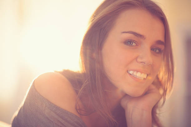 istock Attractive young woman smiling at camera 460227413