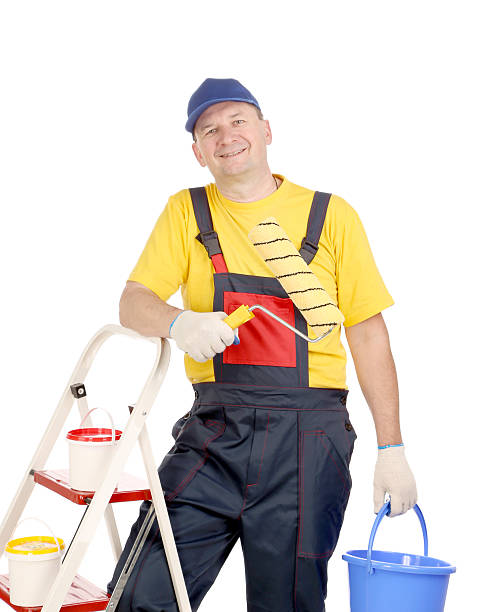 istock Worker on ladder with roller and bucket. 460227691