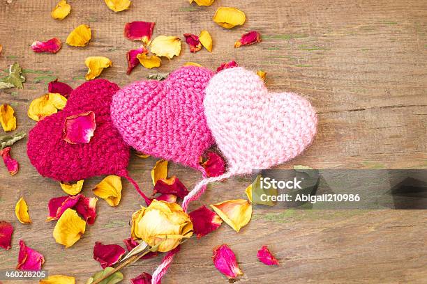 Cute Knitted Hearts On A Wooden Background Stock Photo - Download Image Now - Affectionate, Anniversary, Art And Craft