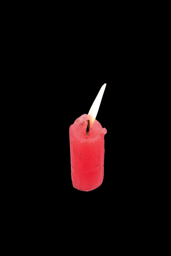 The candle on a black background