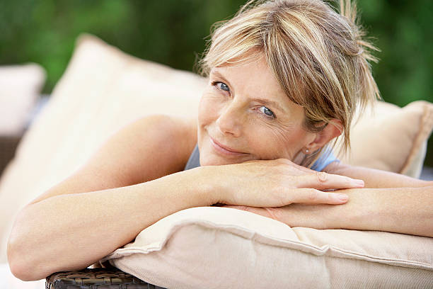 istock Woman Relaxing On Sofa In Garden 460239933