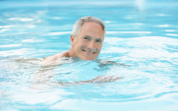 istock Happy Man Swimming In Pool 460239987