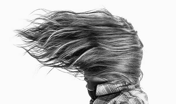 Windswept woman in check shirt