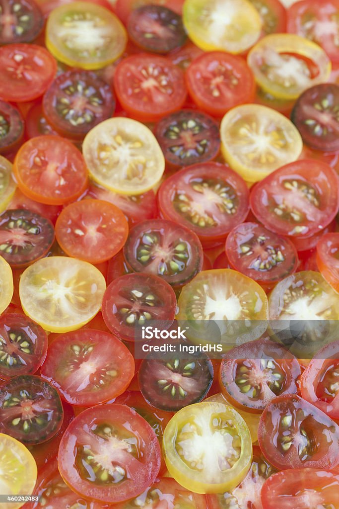 Tomatoe background Background made from yellow, red and black cherry tomatoes Backgrounds Stock Photo