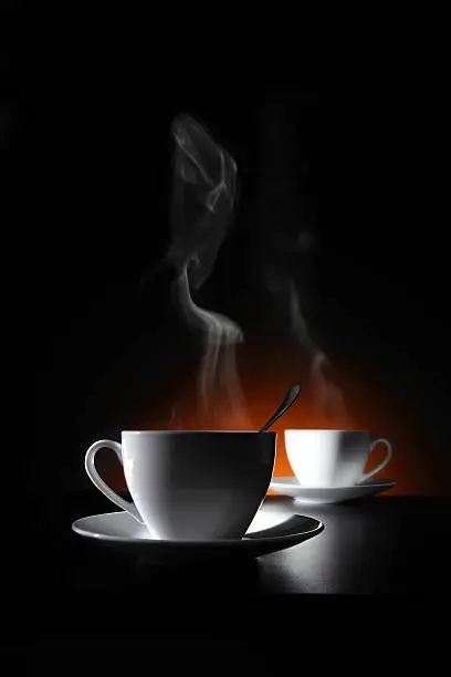 Photo of Two cups with hot coffee