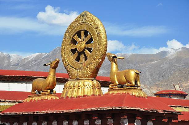 istock Dharma wheel and two deers 460245351