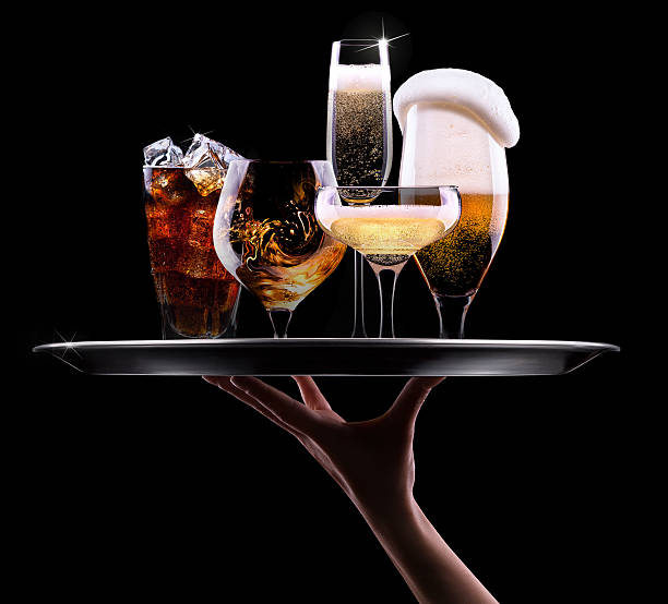 istock Hand holding up a tray with different alcoholic beverages 460246147