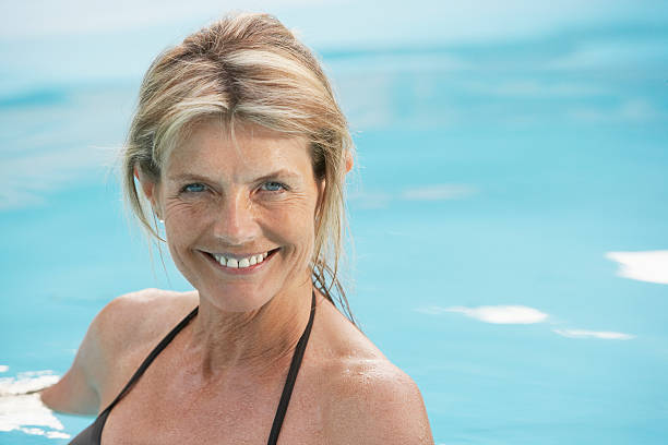 istock Happy Woman In Pool 460249169