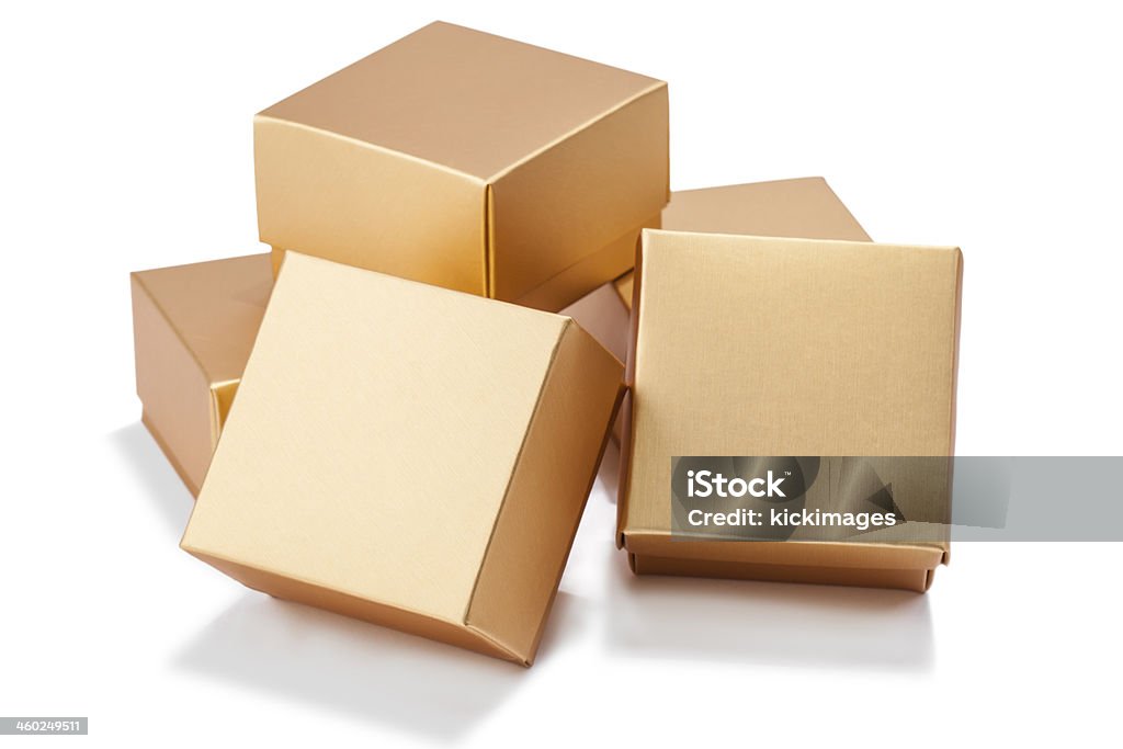 Golden Gift Boxs Pile of golden present boxes, isolated on white background. Gift Stock Photo