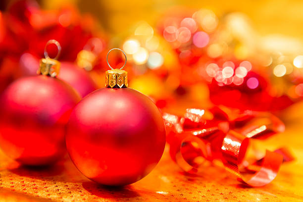 istock Red Christmas balls on a gold background 460253813