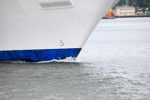 Tug boat bow creating spray outdoor sea - Cruise ship details