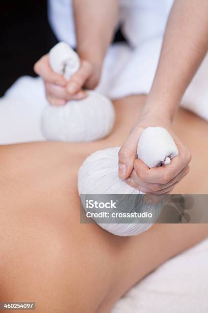 Picture Of Someone Receiving A Back Massage With Thai Balls Stock Photo - Download Image Now