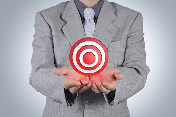 istock businessman pointing target symbol as success concept 460254689