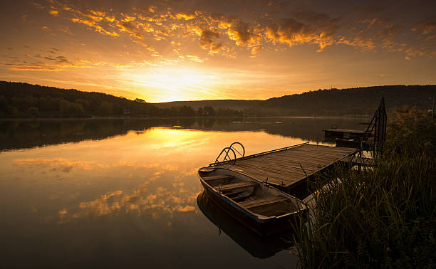 istock Mystical Landscape, Boat on the Pier at sunrise 460255155