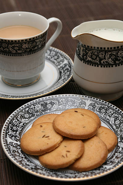 istock Plate full of biscuits served with tea and milk 460256541