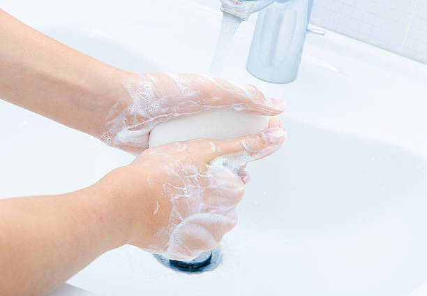istock Washing of hands with soap 460256989