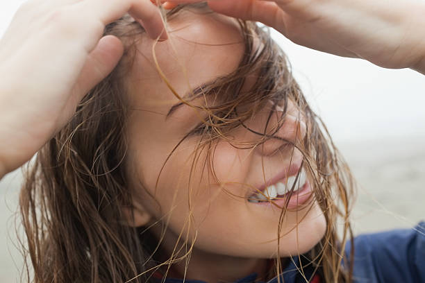 istock Happy wet model wearing navy rain jacket 460258565
