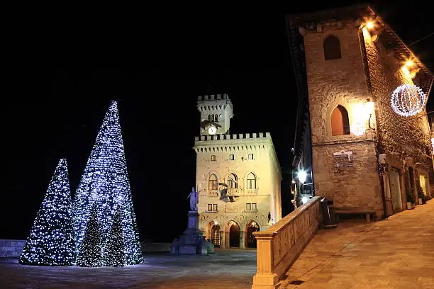 Christmas in San Marino and Government Palace with Statue of Liberty on the background.