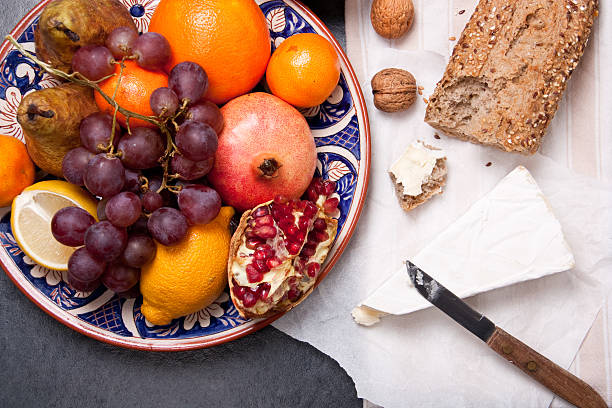 istock Brie cheese with bread and fruits 460271469
