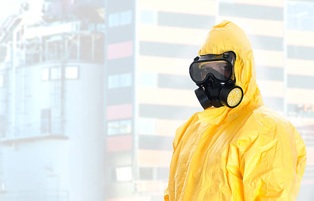 istock Worker in protective chemical suit. Space for your text. 460272953