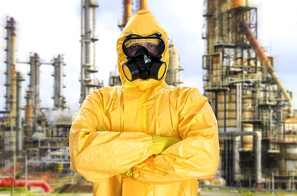 istock Man in chemical protective suit over factory 460272963