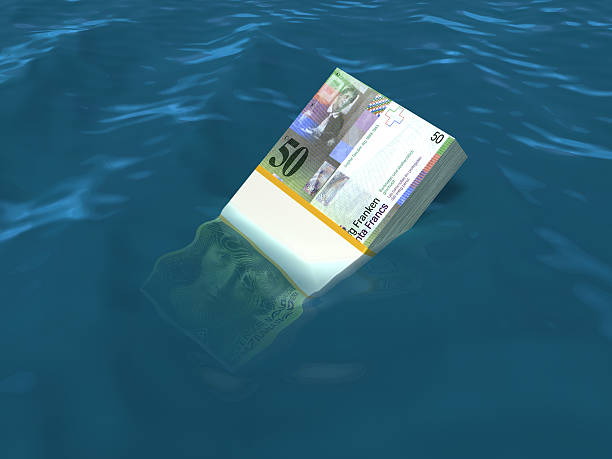 istock Money sinking in water 460277969