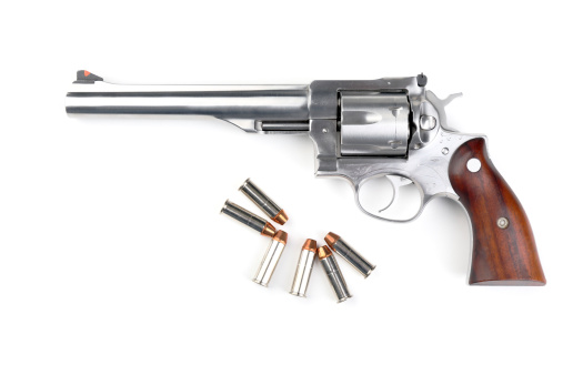 Revolver 44 magnum with bullets isolated on white background