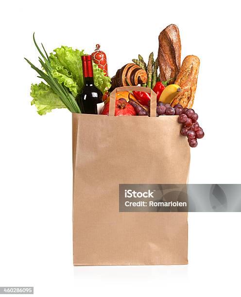 A Paper Bag Full Of Groceries On A White Background Stock Photo - Download Image Now