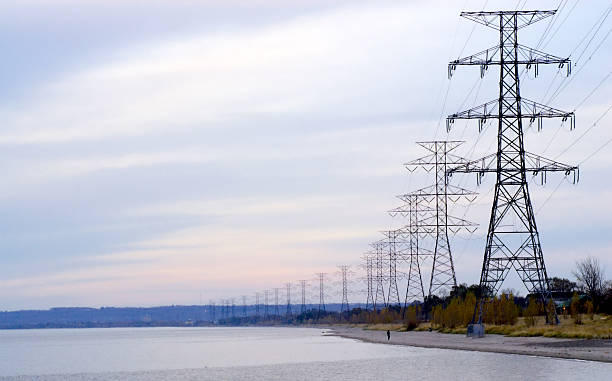 istock Row of electrical towers receding 460297933