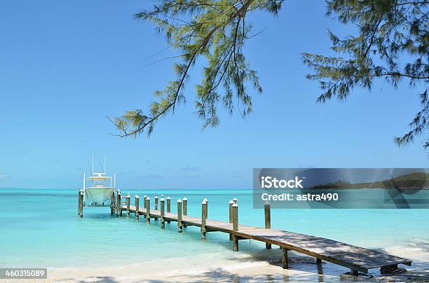 Wooden Pier In The Bahamas With Boat In Background Stock Photo - Download Image Now - Exuma, Island, Bahamas