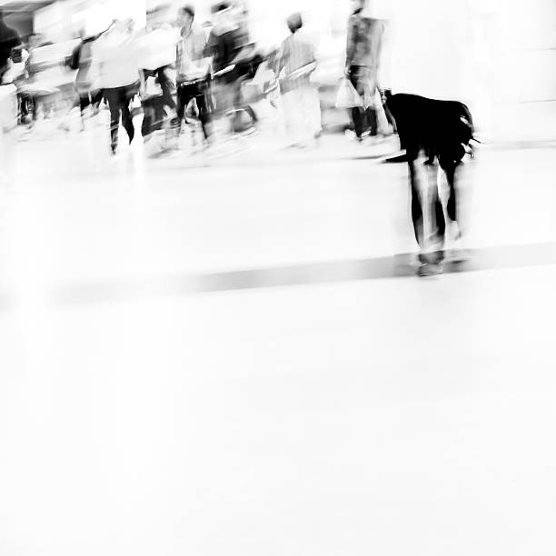 istock black and white blur passenger walk at subway station 460315811