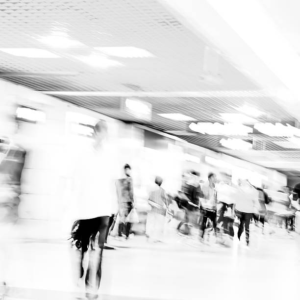 istock black and white blur passenger walk at subway station 460315859