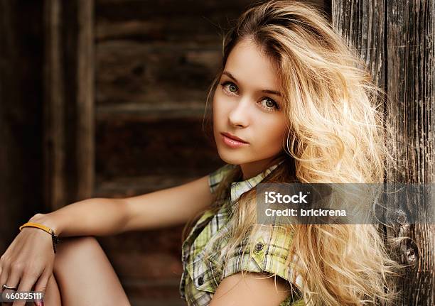 Portrait Of Blonde Woman At The Wooden Background Stock Photo - Download Image Now - Adult, Adults Only, Beautiful People