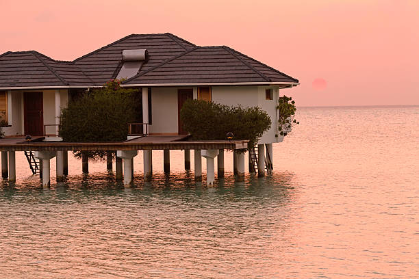 istock Bungalow in Ocean at Sunset, Maldives 460327511