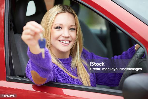 Teenage Sitting In Car Holding Key Stock Photo - Download Image Now - Car Key, Buying, Car