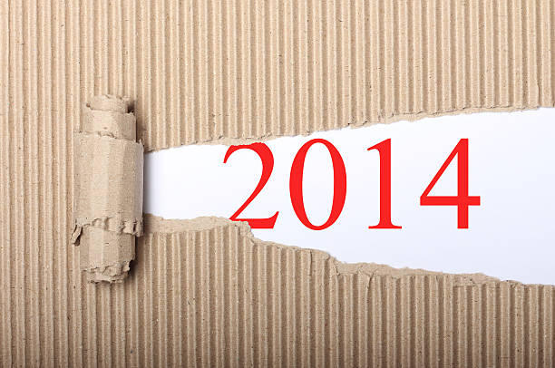 istock Happy New Year 2014 on torn cardbox 460330441