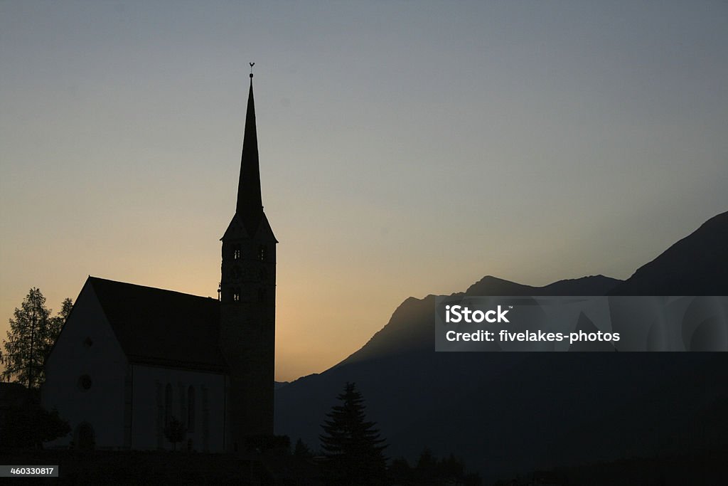 Church in sunrise churches and sunrise atmosphere in the morning in scoul engadin Church Stock Photo