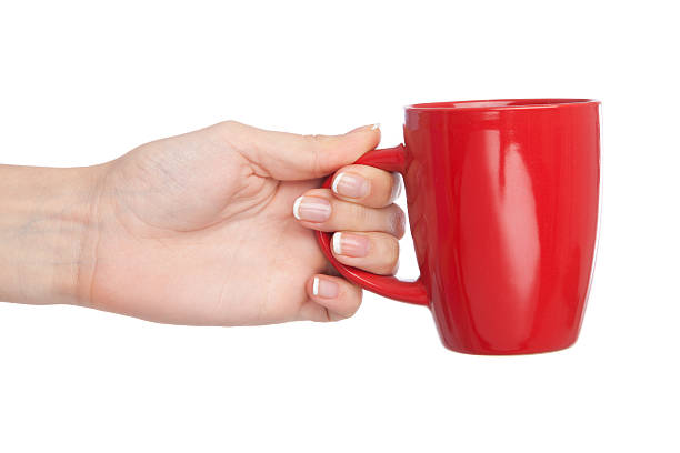 istock Hand holding a cup, isolated on white background 460355789
