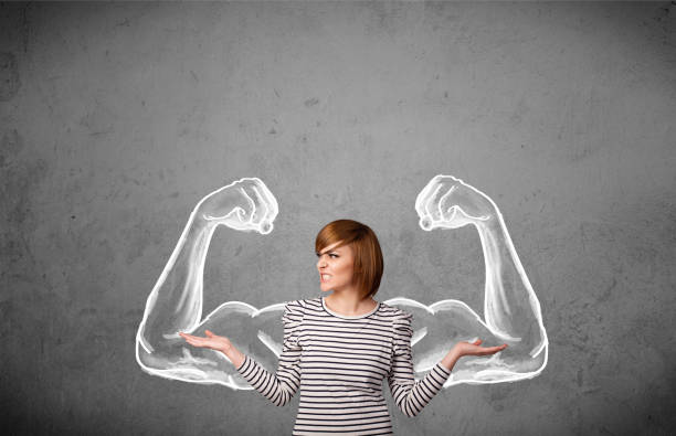 istock Young woman with strong muscled arms 460356151