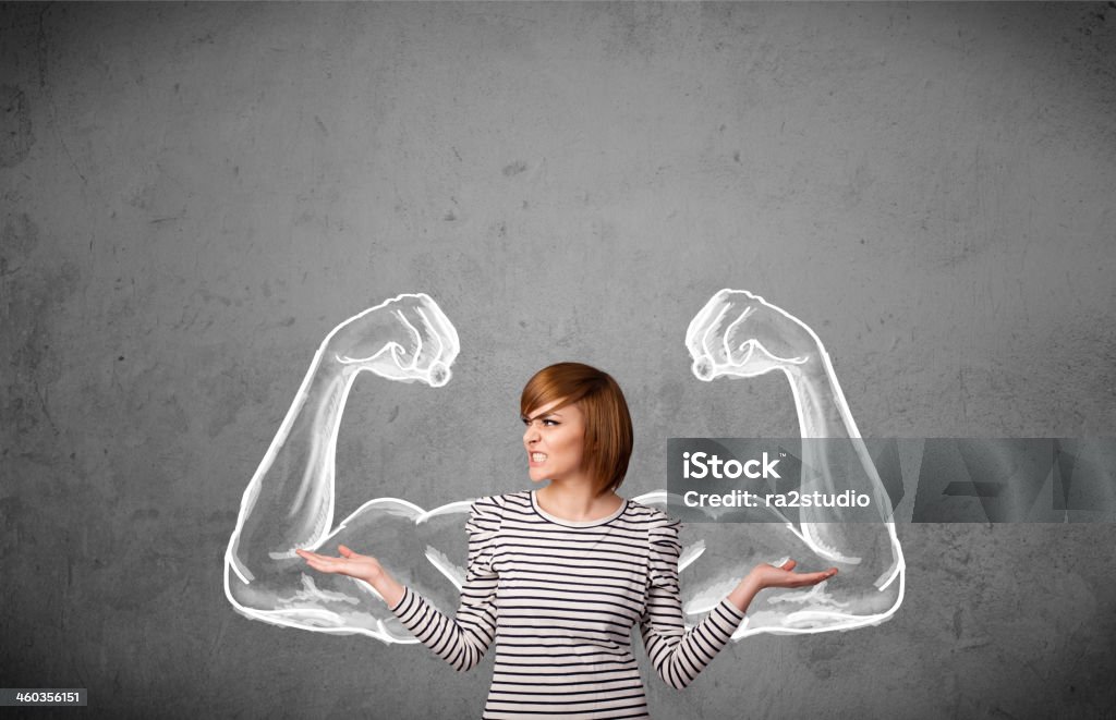 Young woman with strong muscled arms Pretty young woman with sketched strong and muscled arms Adult Stock Photo